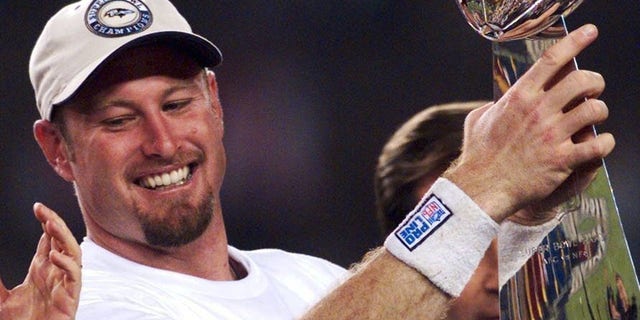 FILE - Trent Dilfer holds the Lombardi Trophy in 2001.