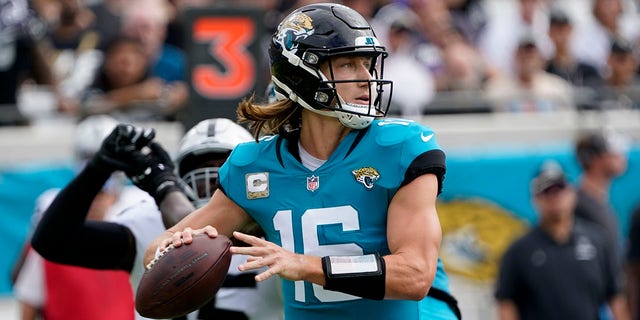 Jacksonville Jaguars quarterback Trevor Lawrence passes against the Las Vegas Raiders in the first half of a game Sunday, Nov. 6, 2022, in Jacksonville, Fla. 