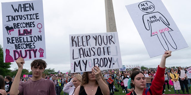 Abortion rights activist rally at the Washington Monument before a march to the U.S. Supreme Court in Washington, May 14, 2022.