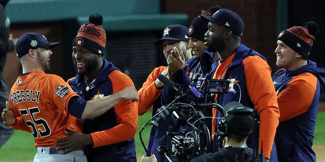 Ryan Pressly #55 and Cristian Javier #53 of the Houston Astros celebrate after defeating the Philadelphia Phillies 5-0 in a combined no-hitter in Game Four of the 2022 World Series at Citizens Bank Park on November 02, 2022 in Philadelphia, Pennsylvania.