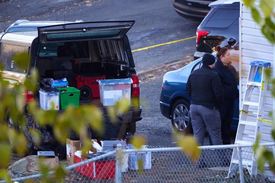 Investigators gather evidence at an off-campus home where four University of Idaho students were stabbed to death