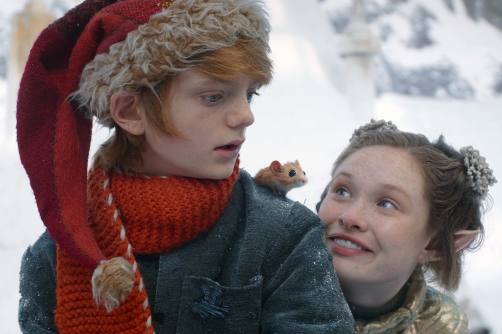 A BOY CALLED CHRISTMAS, from left: Henry Lawfull, with Mikka (voice: Stephen Merchant), Zoe Margaret Colletti, 2021.  © Netflix / Courtesy Everett Collection