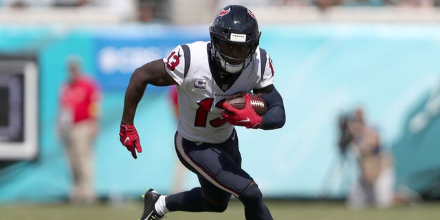 Brandin Cooks of the Houston Texans runs during the first half of a game against the Jacksonville Jaguars at TIAA Bank Field Oct. 9, 2022, in Jacksonville, Fla.