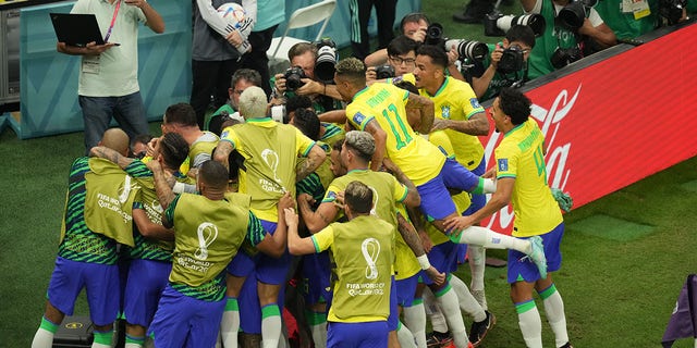 Richarlison of Brazil celebrates after scoring a goal during the FIFA World Cup Qatar 2022 Group G match between Brazil and Serbia at Lusail Stadium in Lusail City, Qatar on November 24, 2022. 