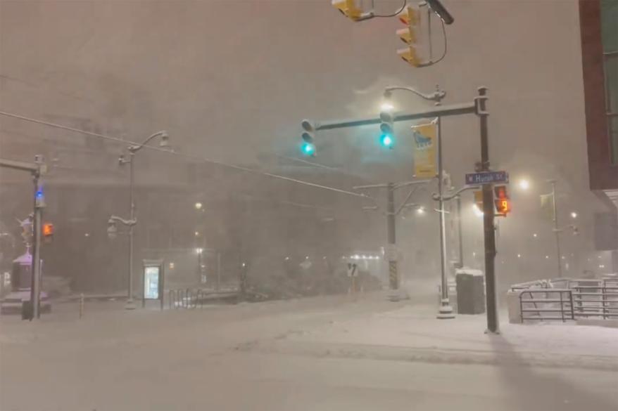 A picture of a street in Buffalo covered in snow.