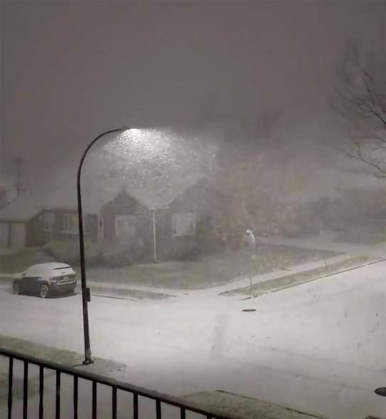 A picture of a street in Buffalo covered in snow.