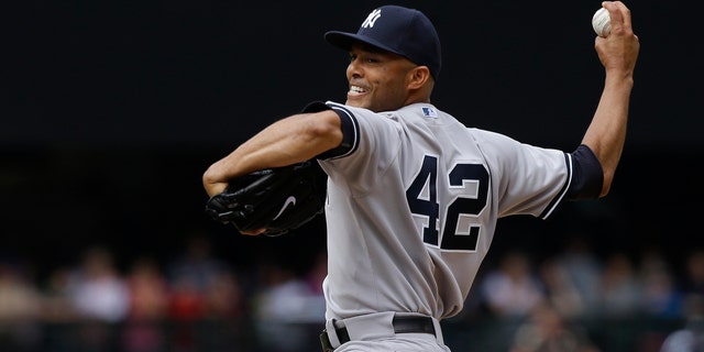 New York Yankees closer Mariano Rivera throws in the ninth inning of a game against the Seattle Mariners June 9, 2013, in Seattle.