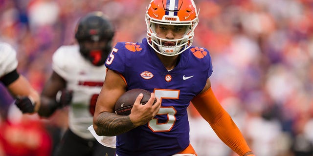 Clemson quarterback DJ Uiagalelei (5) runs for a touchdown in the first half of a game against Louisville Saturday, Nov. 12, 2022, in Clemson, S.C.