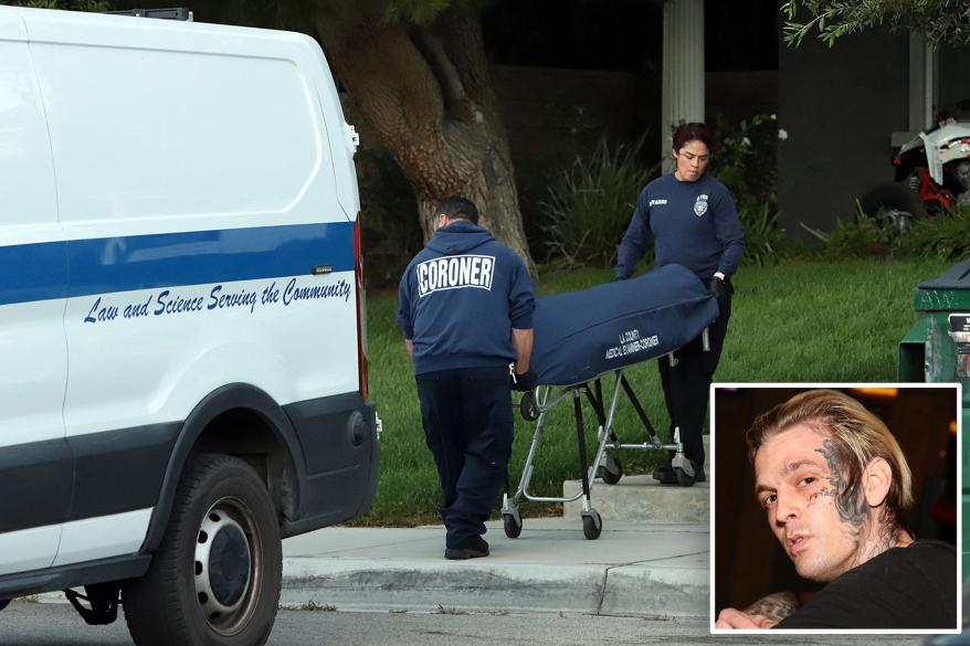 Coroners are seen removing the body of Aaron Carter from his Lancaster home after his death on Saturday.