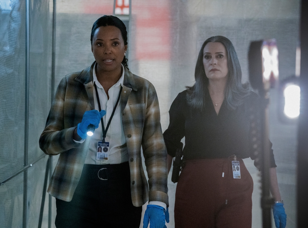 Aisha Tyler as Dr. Tara Lewis  and Paget Brewster as Emily Prentiss in  “Criminal Minds: Evolution" looking serious in a hall. 