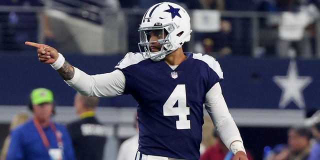 Dak Prescott, #4, of the Dallas Cowboys, reacts after a first down during the first half in the game against the New York Giants at AT&amp;T Stadium on November 24, 2022, in Arlington, Texas. 