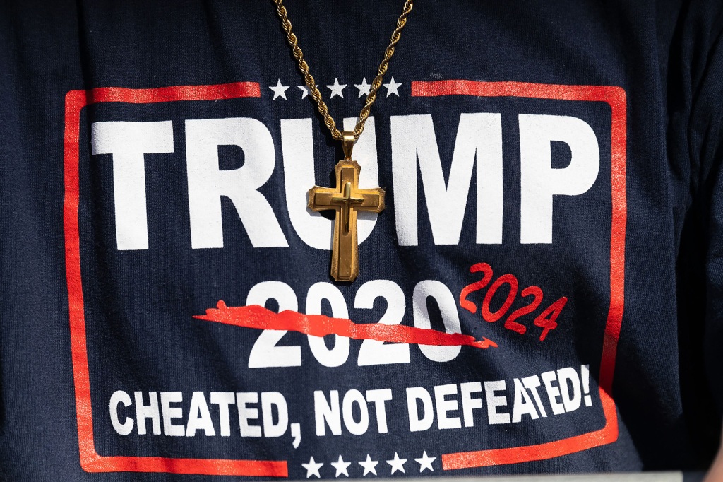 A man wears T-shirt that touts former President Donald Trump running again in 2024 during a rally in Ohio on April 23.