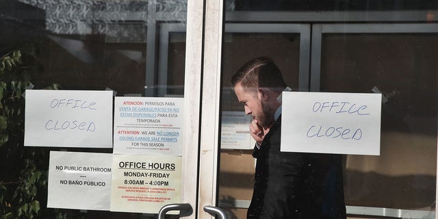 People believed to be federal agents leave the Southside office of 14th Ward Alderman Ed Burke where document boxes and computer equipment was removed on Nov. 29, 2018, in Chicago. The FBI has confirmed that a search warrant was executed at the alderman's offices. 