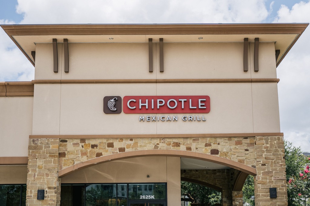 The exterior of a Chipotle Mexican Grill store is shown on June 09, 2021 in Houston, Texas. Menu prices at Chipotle Mexican Grill have risen by roughly four percent to cover the costs of raising its minimum wage to $15 an hour for employees.