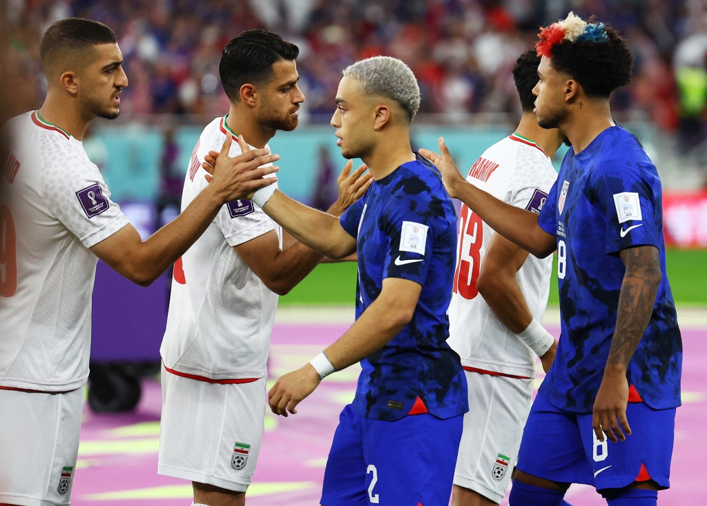 Experts say the Iran soccer team is in an “untenable position” going into the game against the US.