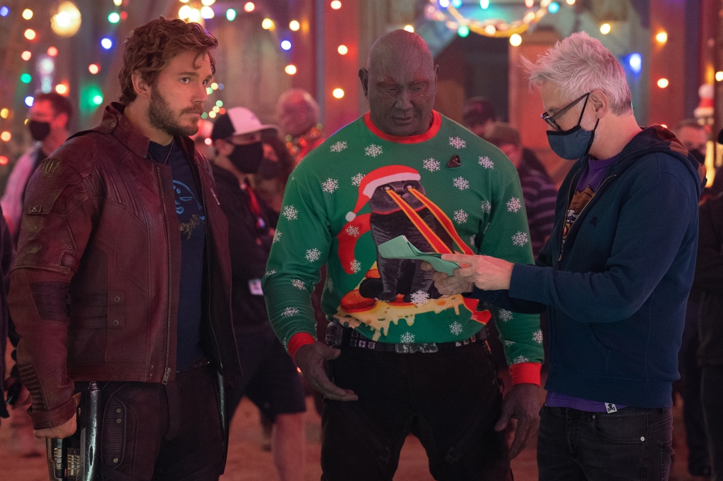 Director/writer James Gunn (right) works with Chris Pratt (left) and Dave Bautista (center) on the set of "The Guardians of the Galaxy Holiday Special."