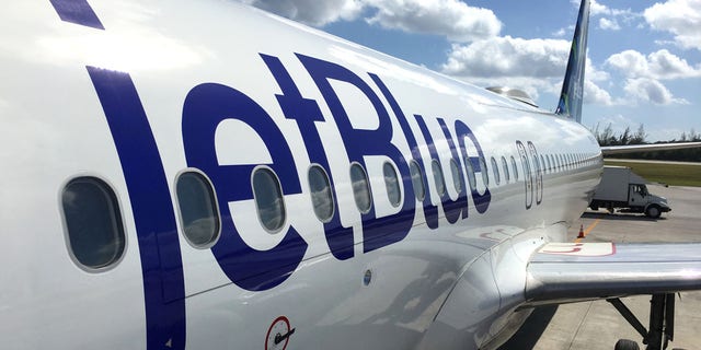 This file photo shows JetBlue land operations and boarding in Owen Roberts Intl. Airport in Grand Cayman Island. 