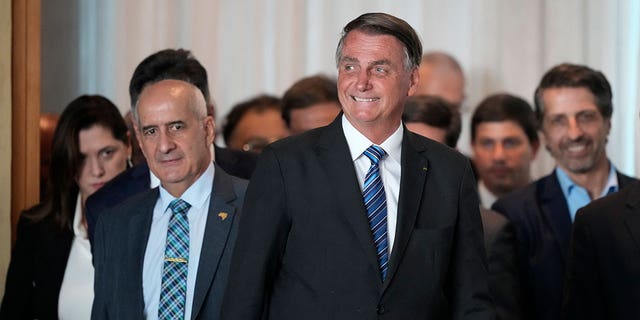 Brazilian President Jair Bolsonaro arrives to speak from his official residence of Alvorada Palace in Brasilia, Brazil, Tuesday, Nov. 1, 2022, the leader's first public comments since losing the Oct. 30 presidential runoff.