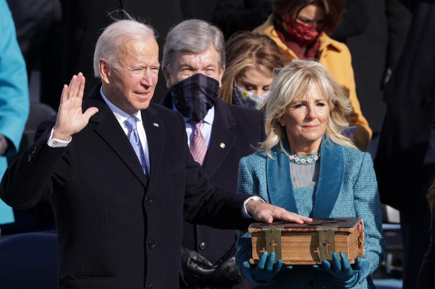 Joe Biden is sworn in as U.S. President as his wife Dr. Jill Biden looks on during his inauguration.