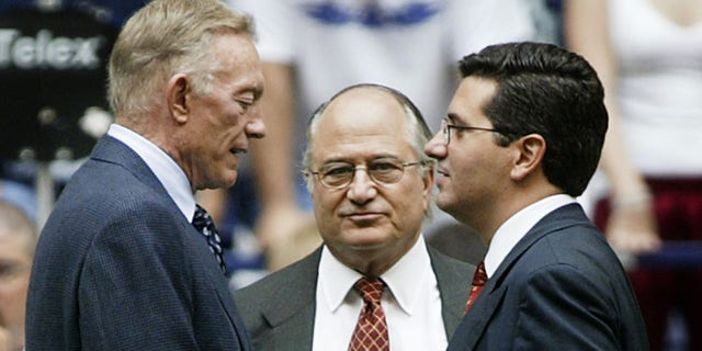 Dallas Cowboys owner Jerry Jones meets with Dan Snyder before a game.  