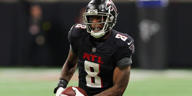 Kyle Pitts #8 of the Atlanta Falcons runs after a reception against the Carolina Panthers during the fourth quarter at Mercedes-Benz Stadium on October 30, 2022 in Atlanta, Georgia.