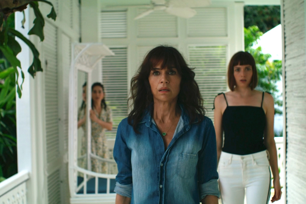 Ana de la Reguera as Inocencia, Carla Gugino as Alba, Gaite Jansen as Batty in "Leopard Skin" stand in a living room looking worried. 