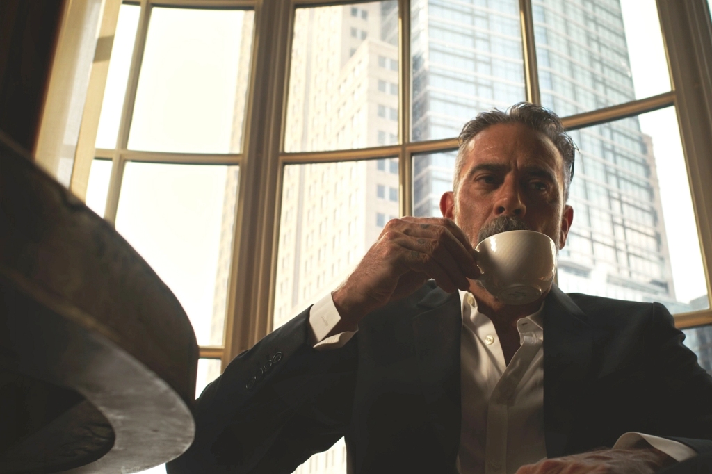 Jeﬀrey Dean Morgan as Ray Lasalle, a crime boss, in "Leopard Skin" sipping coffee. 