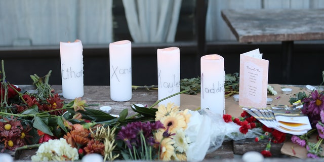 A small memorial is seen at the Mad Greek restaurant in Moscow, Idaho on Tuesday, November 15, 2022. Murder victims, Madison Mogen and Xana Kernodle worked here as servers for a couple years. The sign on door says closed due to loss.