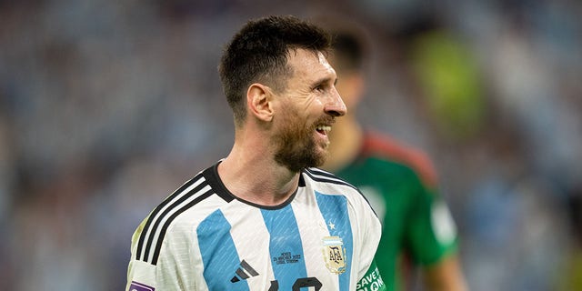 Lionel Messi #10 of Argentina smiles during a FIFA World Cup Qatar 2022 Group C match between Mexico and Argentina at Lusail Stadium on November 26, 2022 in Lusail, Qatar.