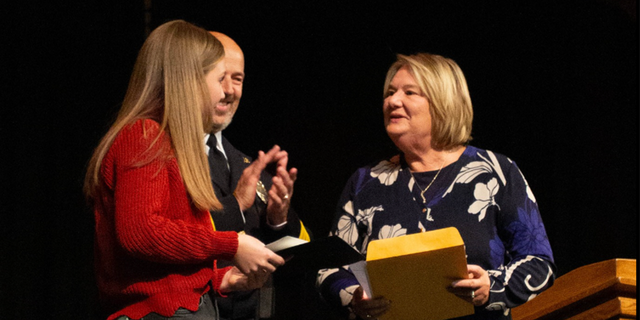 Excelsior Springs Mayor Sharon Powell presents Ava Donegan with award. 