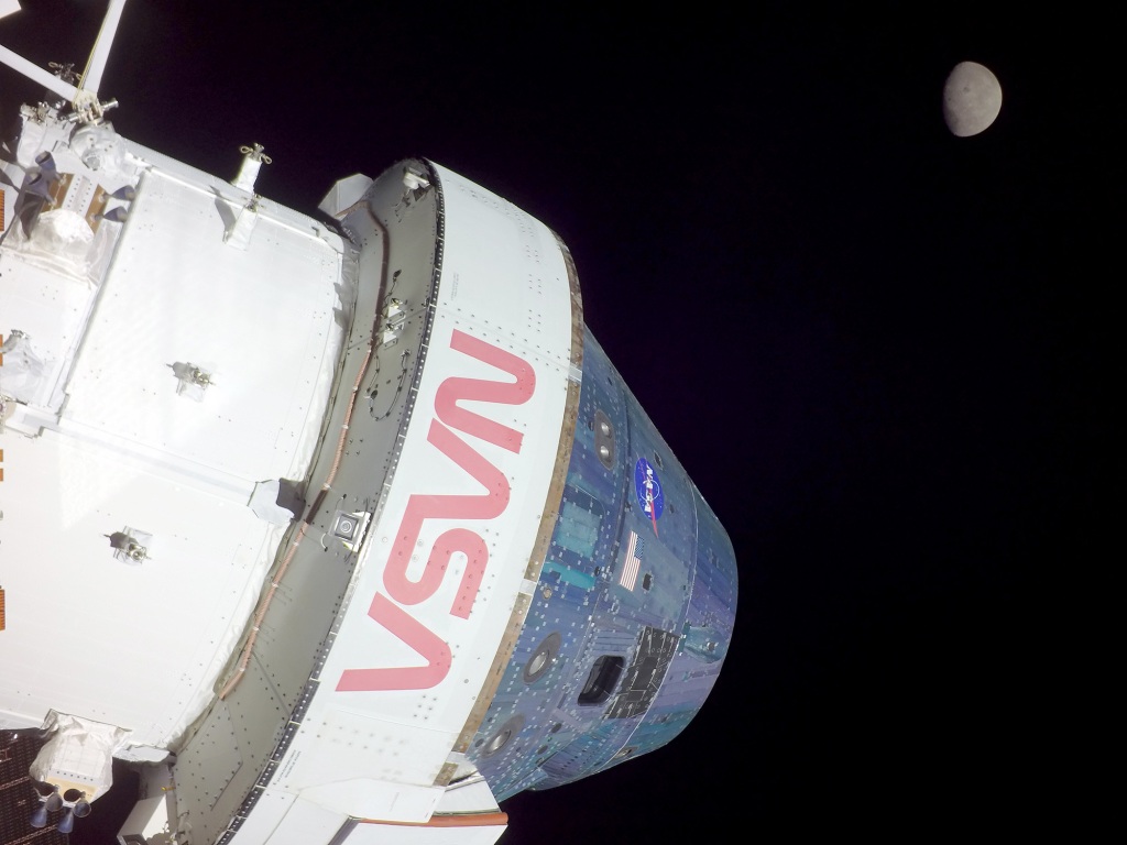 The Moon is seen as flight control team used the cameras on the Orion's solar wings to do a thorough inspection of the spacecraft. 