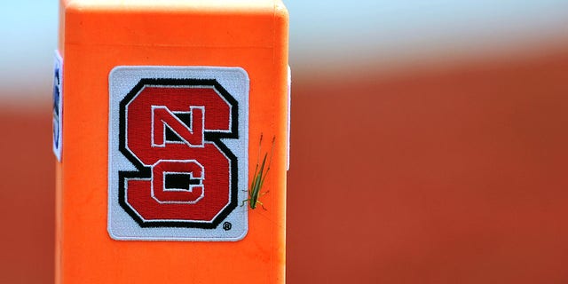 A field marker with the North Carolina State Wolfpack logo and a grasshopper during a game at Carter-Finley Stadium Aug. 30, 2014, Raleigh, N.C.