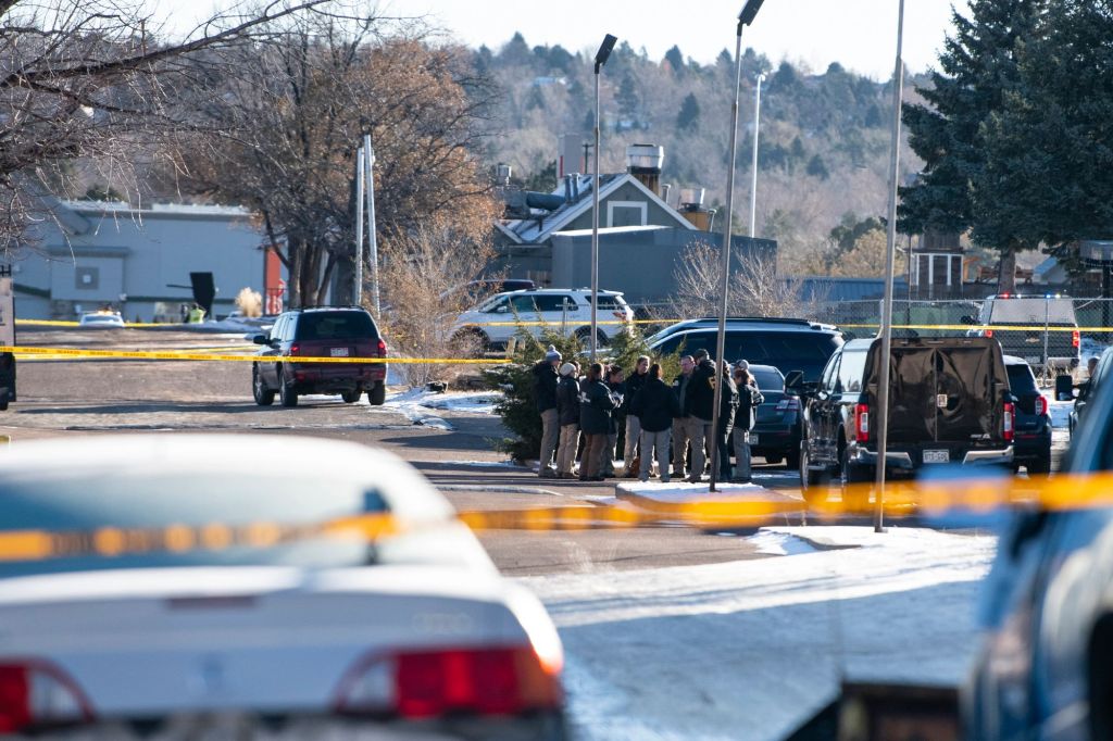Law enforcement personnel stand outside Club Q following the shooting in Colorado Springs, Colo., on Nov. 20, 2022. 