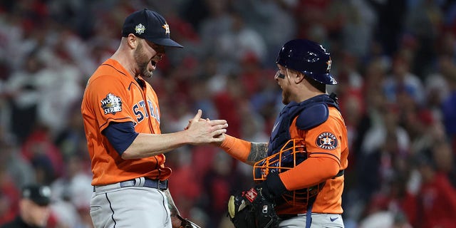 Ryan Pressly #55 ad Christian Vazquez #9 of the Houston Astros celebrate a combined no-hitter to defeat the Philadelphia Phillies 5-0 in Game Four of the 2022 World Series at Citizens Bank Park on November 02, 2022 in Philadelphia, Pennsylvania. 