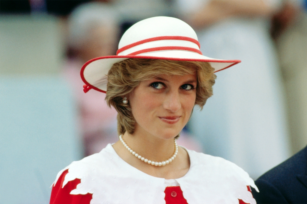 Diana, Princess of Wales, wears an outfit in the colors of Canada during a state visit to Edmonton, Alberta, with her husband.