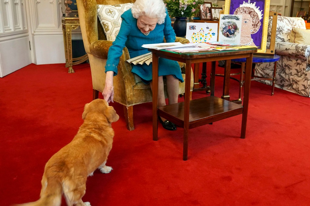 Queen Elizabeth II with one of her dogs.