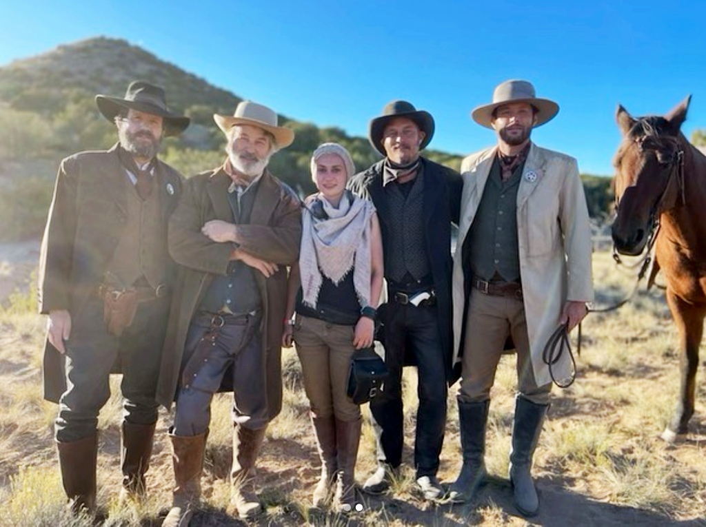 (l-r) Josh Hopkins, Alec Baldwin, Halyna Hutchins, Travis Fimmel and Jensen Ackles on the set of "Rust" last year before fatal shooting.