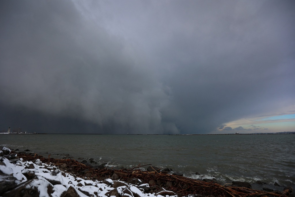 A cloud of snow is seen crossing Lake Erie as extreme winter weather hits Buffalo