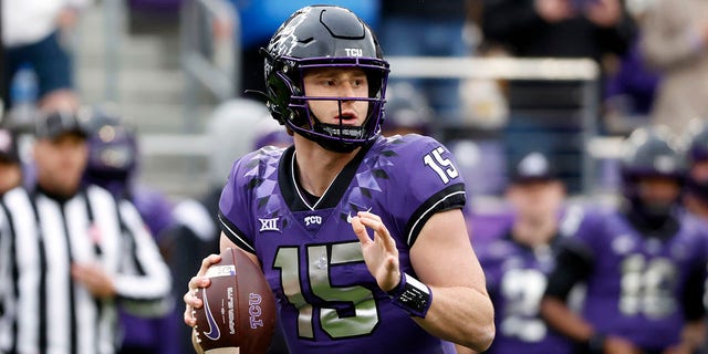 Quarterback Max Duggan #15 of the TCU Horned Frogs looks to throw against the Iowa State Cyclones during the first half at Amon G. Carter Stadium on November 26, 2022 in Fort Worth, Texas. 