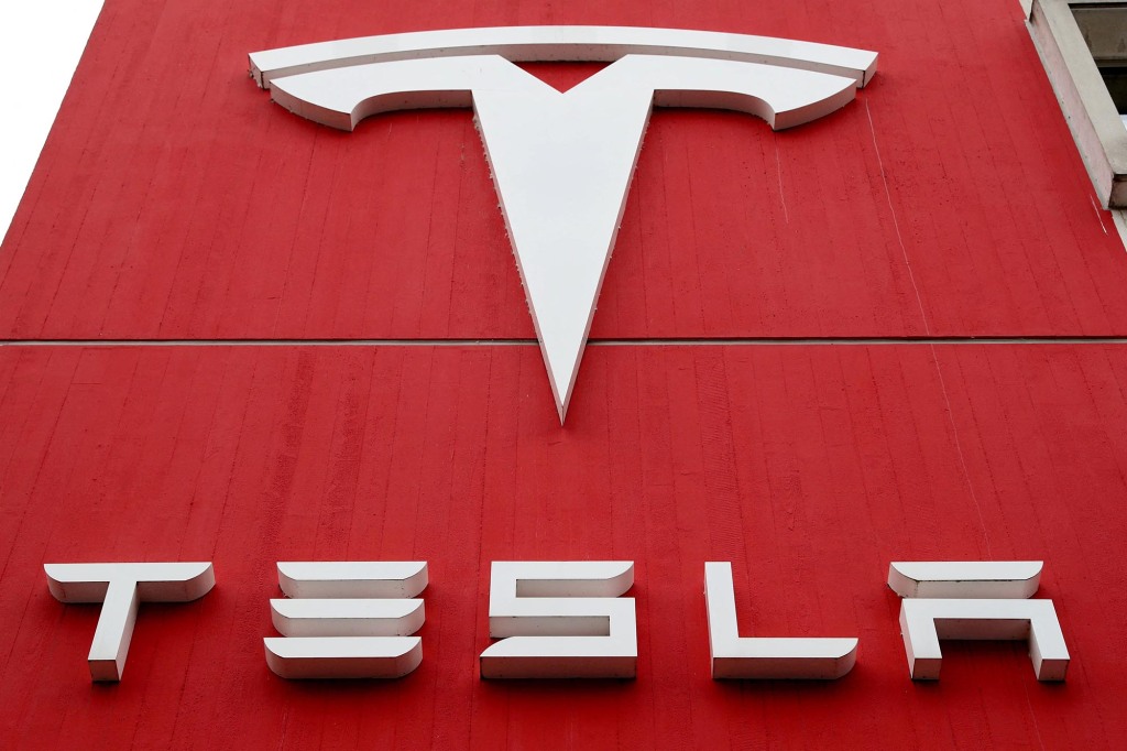 A picture of the Tesla logo at a branch office. 