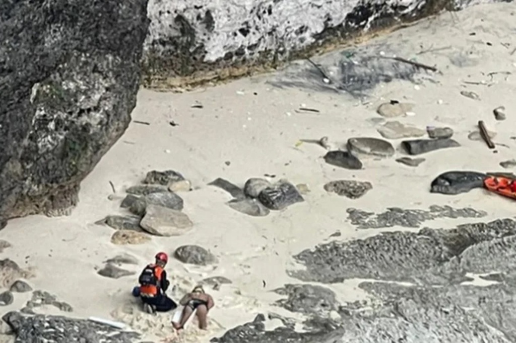 Injured man on beach