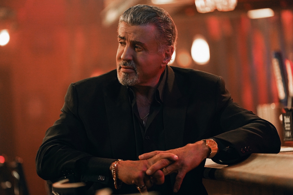 Sylvester Stallone in "Tulsa King" sitting in a bar. 
