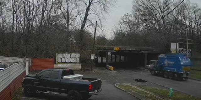 Calm before the storm: dramatic video captures the garbage truck driving along East New York Street in Indianapolis just before 8am on Monday.