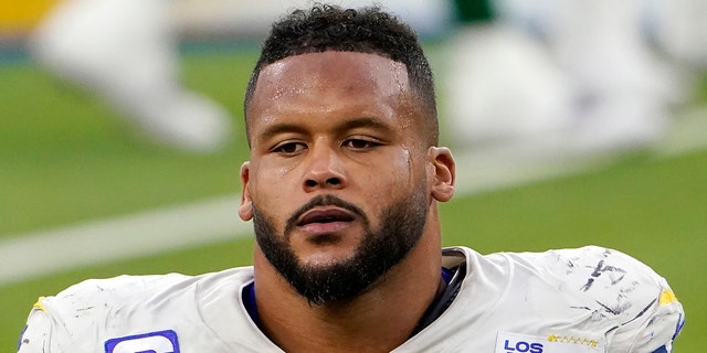 Los Angeles Rams defensive end Aaron Donald walks off the field after a loss to the New York Jets in Inglewood, Calif., Dec. 20, 2020.