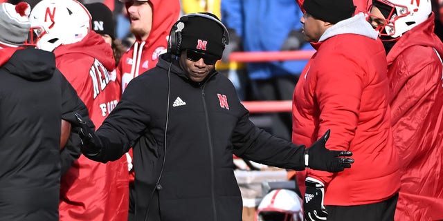 Interim head coach Mickey Joseph of the Nebraska Cornhuskers walks the sidelines against the Wisconsin Badgers during the second half at Memorial Stadium on November 19, 2022, in Lincoln, Nebraska. 