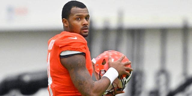 Cleveland Browns quarterback Deshaun Watson stands on the field during an NFL football practice at the team's training facility Wednesday, Nov. 30, 2022, in Berea, Ohio.