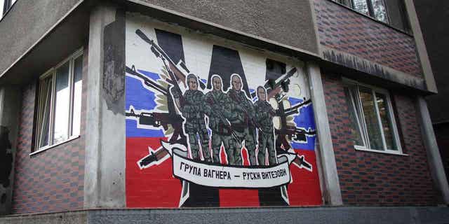 A mural depicting Russia's paramilitary mercenaries "Wagner Group" reading, "Wagner Group - Russian knights" on a building's wall in Belgrade, on Nov. 17, 2022. 