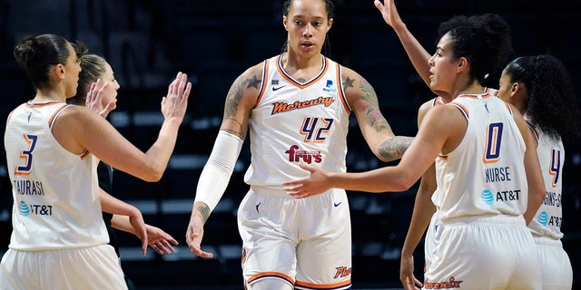 FILE - Phoenix Mercury's Brittney Griner, #42, is congratulated on a play against the Seattle Storm in the first half of the second round of the WNBA basketball playoffs Sunday, Sept. 26, 2021, in Everett, Washington.