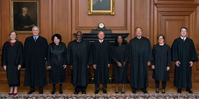 Members of the Supreme Court (L-R) Associate Justices Amy Coney Barrett, Neil M. Gorsuch, Sonia Sotomayor, and Clarence Thomas, Chief Justice John G. Roberts, Jr., and Associate Justices Ketanji Brown Jackson, Samuel A. Alito, Jr., Elena Kagan, and Brett M. Kavanaugh pose in the Justices Conference Room prior to the formal investiture ceremony of Associate Justice Ketanji Brown Jackson September 30, 2022 in Washington, DC. 