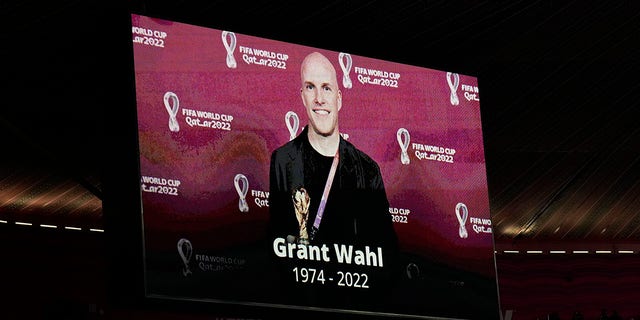 A tribute to journalist Grant Wahl is show on a screen before the World Cup quarterfinal soccer match between England and France, at the Al Bayt Stadium in Al Khor, Qatar, Saturday, Dec. 10, 2022. Wahl, one of the most well-known soccer writers in the United States, died early Saturday Dec. 10, 2022 while covering the World Cup match between Argentina and the Netherlands.